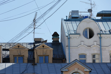 Old street facades and roofs of houses. Arch window. Moscow residential buildings. Old Moscow...
