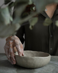 hands of a potter at work