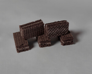 Chocolate biscuit wafers filled with delicious chocolate cream. Wafers are usually sweet, thin, flat, and dry. Dry and crunchy wafers are ready to eat. Chocolate wafer mockup. Focus blur.