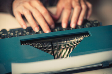 Vintage female writer reporter working behind his desk