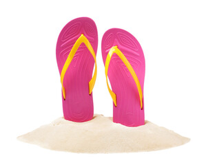 Pink flip flops in sand on white background