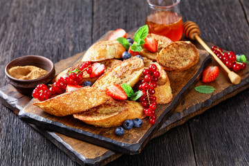 crispy sweet toasts with fresh berries and honey