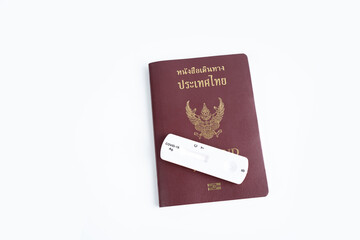 Nakhon Pathom, Thailand - 23 August 2021 : Top view of passport and Rapid antigen test Rapid Strep Test RST kit.
