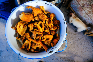 Fresh brown cooked pork served in white cooking pot