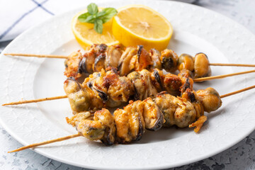 Fried mussels, delicious skewered mussels (Turkish name; midye tava, cöp sis midye)