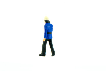 Miniature people engineer worker construction concept on white background with a space for text