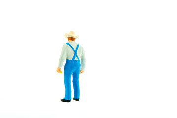 Miniature farmer people isolated with clipping path on white background . Elegant Design with copy space for placement your text, mock up for farmer and gradening concept.