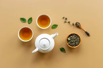 Foto auf Acrylglas Two cups of tea with white teapot, top view © 9dreamstudio