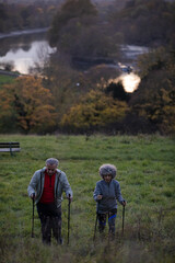 Smiling, affectionate senior couple wih walking stick
