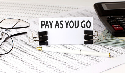 Word writing text PAY AS YOU GO on white sticker on chart background. Business concept