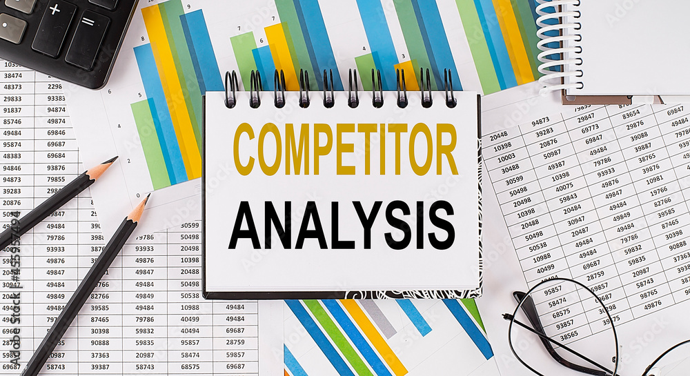 Poster closeup a notebook with text competitor analysis , business concept image on chart background