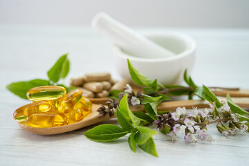 Alternative medicine herbal organic capsule with vitamin E omega 3 fish oil, mineral, drug with herbs leaf natural supplements for healthy good life.