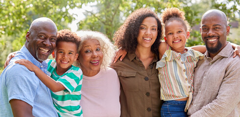 Portrait Of Smiling Multi-Generation Family At Home In Garden Together