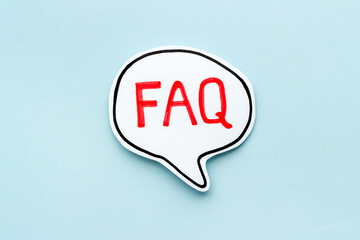 Faq - frequently asked questions - text on paper bubble, top view