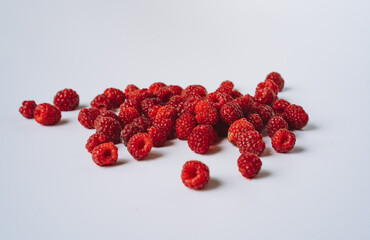 freshly red raspberries isolated on white background