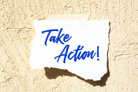 Take Action write on Sticky Notes. Motivation conceptual Image
