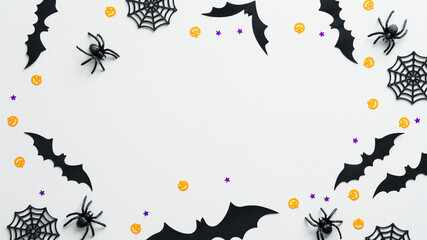 Happy Halloween holiday concept. Halloween decorations on white background. Flat lay, top view...