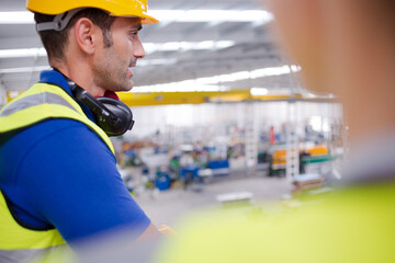 Portrait confident worker in steel factory