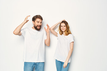 young couple in white t-shirts and jeans casual wear fashion mockup