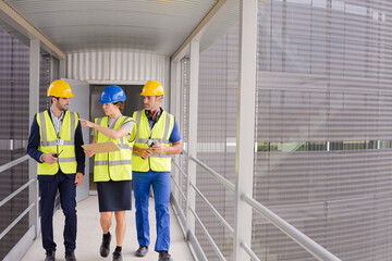 Supervisors and worker in steel factory