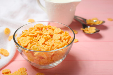 Fototapeta na wymiar Crispy cornflakes with milk for breakfast on the table close-up.