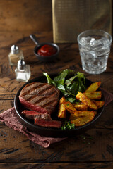 Beef steak with roasted potato and salad