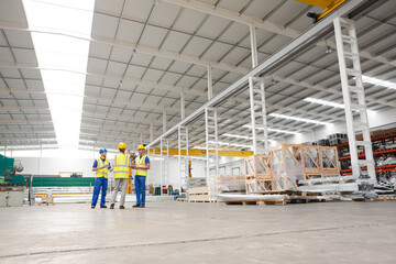 Supervisor and workers talking in warehouse