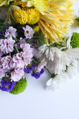 greeting card design. autumn bouquet. bouquet of multi-colored chrysanthemums on a white background and space for text. invitation. congratulation 