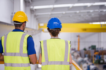 Supervisor and worker in factory