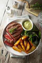 Beef steak with roasted potato and salad