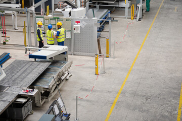 Supervisor and workers talking in factory
