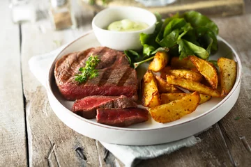 Foto auf Acrylglas Beef steak with roasted potato and salad © marysckin