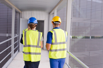 Supervisors and worker in steel factory