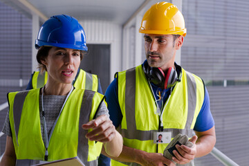 Supervisors and worker in steel factory