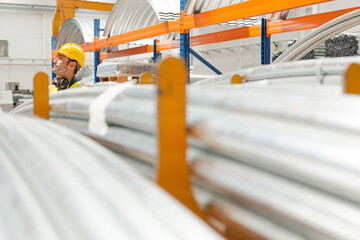 Naklejka premium Male worker looking up in factory