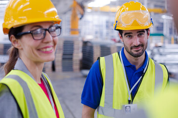 Workers talking in steel factory