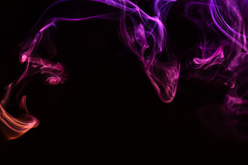 Fototapeta na wymiar Abstract colored smoke hookah on dark background. Texture. Art Design element. Personal vaporizers fragrant steam. Concept of alternative non-nicotine smoking. E-cigarette. Evaporator.