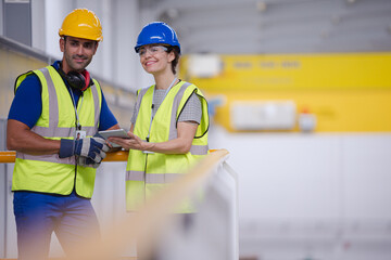 Supervisor and worker in steel factory