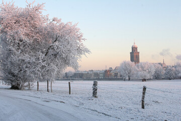 View on the city of Deventer, the Netherlands, on a cold day in winter with snow and frost