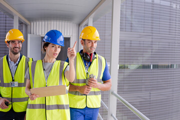 Supervisors and worker in steel factory