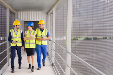 Supervisors and worker in steel factory