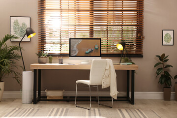 Light room interior with comfortable workplace near window - Powered by Adobe