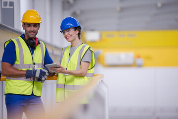 Supervisor and worker in steel factory