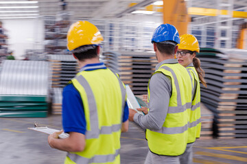 Supervisor and workers talking in warehouse