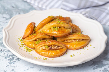 Dilberdudagi with walnut, traditional feast and ramadan dessert with syrup (Turkish name; Dilber dudagi)
