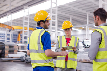 Supervisor and workers talking in steel factory