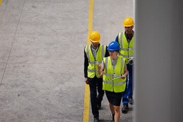 Supervisor and workers talking in factory