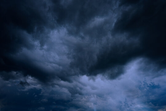 Heavy gray storm clouds. Gloomy sky background for design.