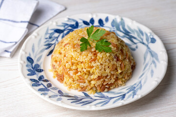 Traditional delicious Turkish food, bulgur pilaf with vermicelli (Turkish name; arpa sehriyeli bulgur pilavi)