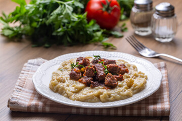 Turkish Food Hunkar Begendi made with Eggplant and Meat.